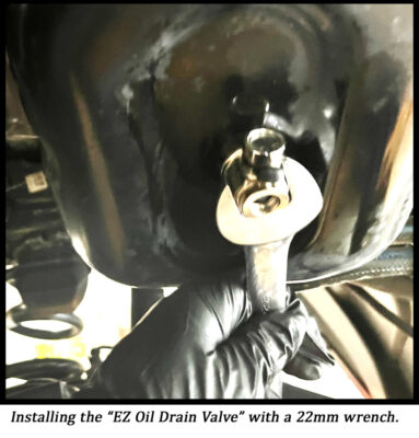 opening motor oil drain valve with wrench Cummins Turbo Diesel